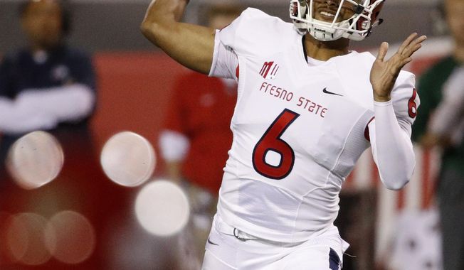 Fresno State Bulldogs quarterback Marcus McMaryion passes against the UNLV Rebels during the first half of an NCAA college football game Saturday, Nov. 3, 2018, in Las Vegas. (AP Photo/John Locher)