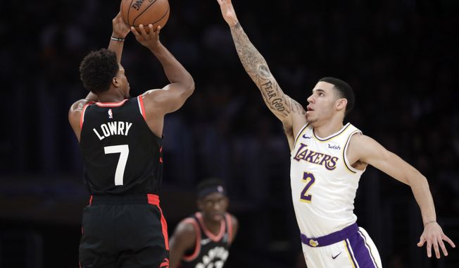 Toronto Raptors&#x27; Kyle Lowry (7) shoots over Los Angeles Lakers&#x27; Lonzo Ball (2) during the first half of an NBA basketball game Sunday, Nov. 4, 2018, in Los Angeles. (AP Photo/Marcio Jose Sanchez)