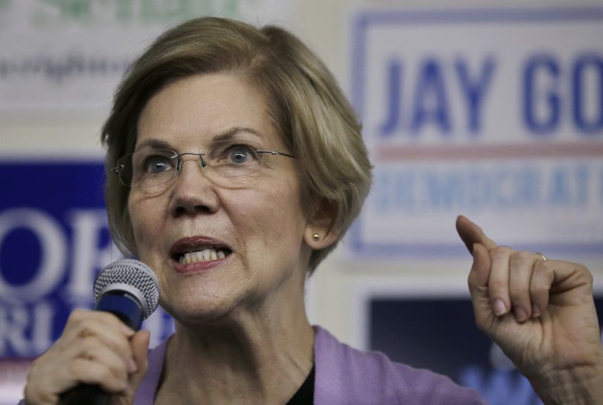 Democrat U.S. Sen. Elizabeth Warren addresses a crowd during a campaign stop Monday, Nov. 5, 2018, in Lynn, Mass. Republican Geoff Diehl is challenging Warren in the November general election. (AP Photo/Steven Senne)