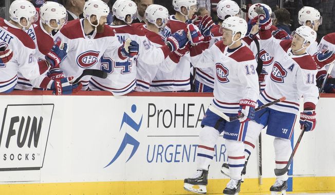 Montreal Canadiens left wing Max Domi (13) celebrates after scoring a goal in the second period of an NHL hockey game against the New York Islanders, Monday, Nov. 5, 2018, in New York. (AP Photo/Mary Altaffer)