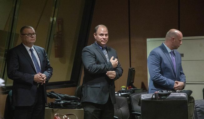 Former Detective David March, from left, Chicago Police Officer Thomas Gaffney and former officer Joseph Walsh appear at a pre-trial hearing with Judge Domenica A. Stephenson at Leighton Criminal Court Building in Chicago on Tuesday, Oct. 30, 2018. Prosecutors have laid out their case against the three Chicago police officers accused of participating in a cover-up of the fatal shooting of Laquan McDonald. (Zbigniew Bzdak/Chicago Tribune via AP, Pool)