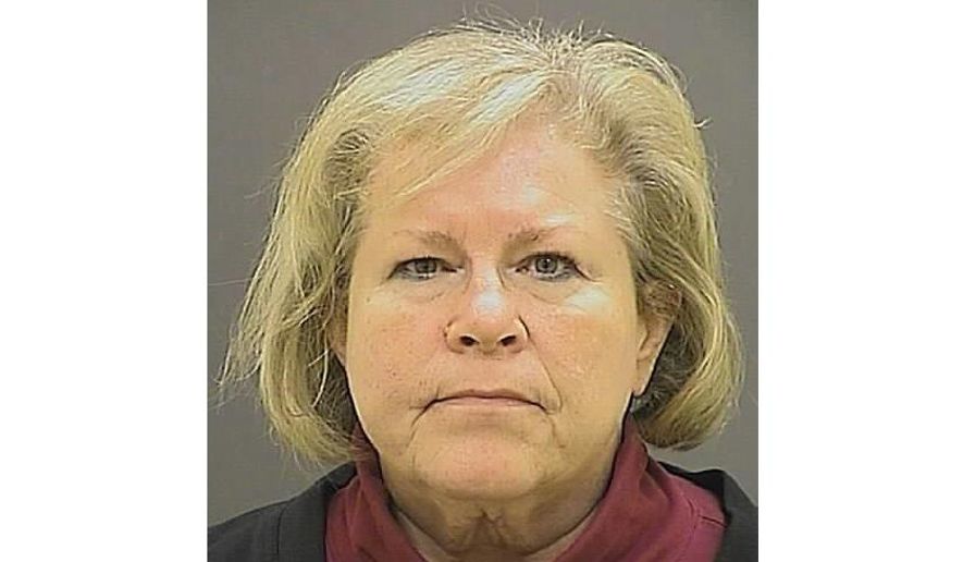 FILE - This undated file photo provided by the Baltimore Police Department shows former Episcopal Bishop Heather Cook. A Maryland judge is set to decide whether to reduce a prison sentence for the former Episcopal bishop who was drunk and texting when she struck and killed a bicyclist with her vehicle. The Baltimore Sun reports that Baltimore Circuit Judge Timothy Doory is scheduled to preside over a hearing Monday, Nov. 5, 2018, for Cook's request for a reduction in her five-year sentence. The 62-year-old Cook has served approximately three years of her sentence for the 2014 collision that killed Thomas Palermo. (Baltimore Police Department via AP, File)