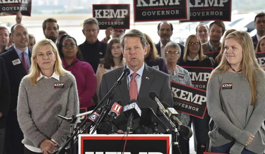 Georgia Republican gubernatorial candidate Brian Kemp speaks during a campaign stop at Peachtree DeKalb Airport on Monday, Nov. 5, 2018. (Hyosub Shin/Atlanta Journal-Constitution via AP)