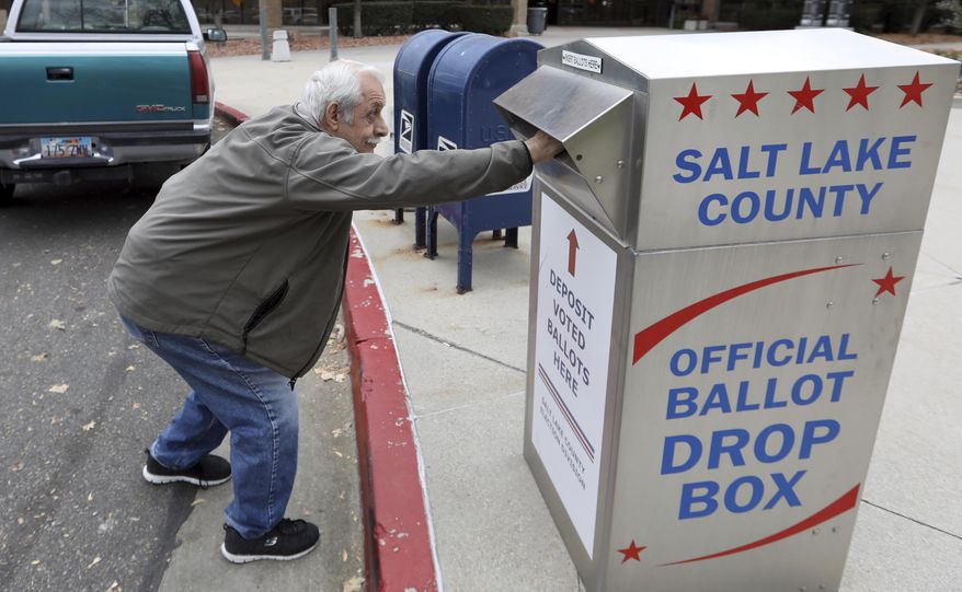 FILE - In this Wednesday, Oct. 31, 2018, file photo, a voter drops off his ballot in Salt Lake City. Many voters have already sent in their ballots, with 27 of the state's 29 counties offering mail-in balloting. As of Friday, nearly 513,000 ballots had been turned in, about 37 percent of the total active registered voters. More than two-thirds of the votes this election are expected to come by these ballots, which can also be dropped off at polling places. (AP Photo/Rick Bowmer, File )