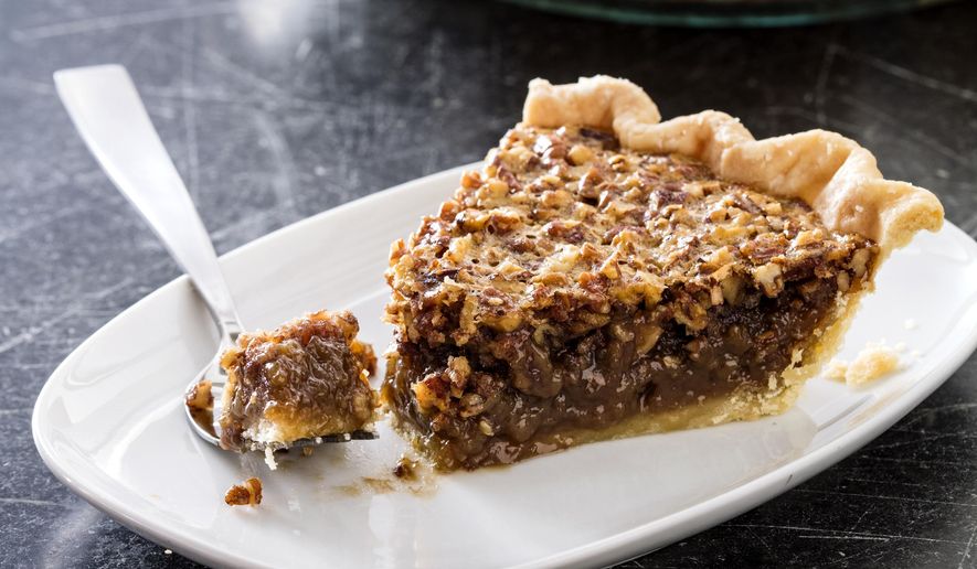 This undated photo provided by America's Test Kitchen in October 2018 shows classic pecan pie in Brookline, Mass. This recipe appears in the cookbook “All-Time Best Holiday Entertaining.” (Daniel J. van Ackere/America's Test Kitchen via AP)