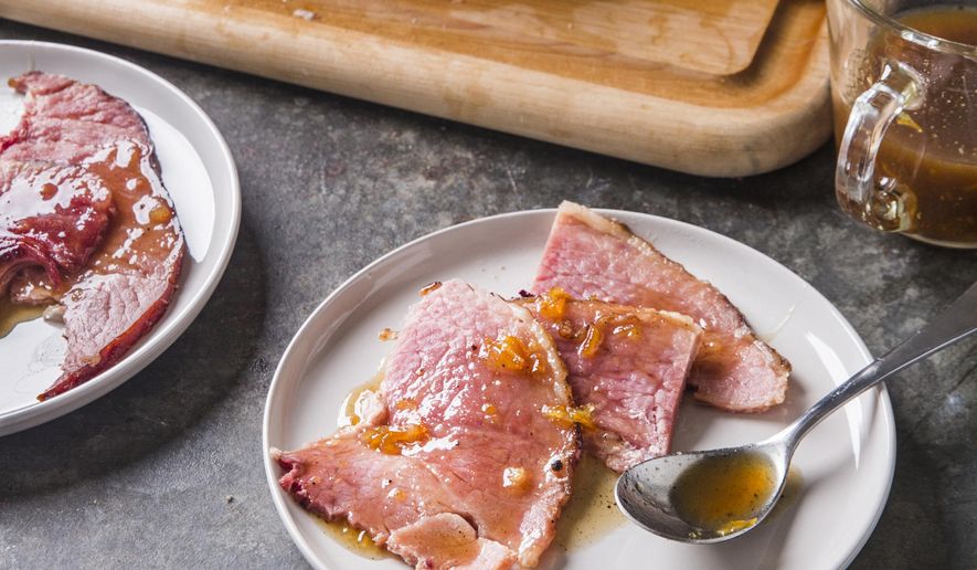 This undated photo provided by America's Test Kitchen in October 2018 shows glazed spiral-sliced ham in Brookline, Mass. This recipe appears in the cookbook “All-Time Best Holiday Entertaining.” (Joe Keller/America's Test Kitchen via AP)