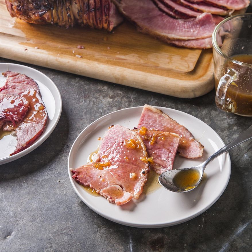 This undated photo provided by America's Test Kitchen in October 2018 shows glazed spiral-sliced ham in Brookline, Mass. This recipe appears in the cookbook “All-Time Best Holiday Entertaining.” (Joe Keller/America's Test Kitchen via AP)