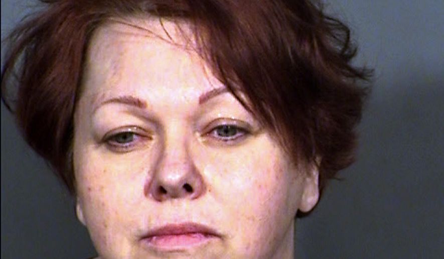 FILE - This undated Clark County Detention Center file booking photo shows April Parks. A former court-appointed financial guardian, her husband, her office manager and a lawyer have taken plea deals in what authorities called the biggest elder exploitation case ever prosecuted in Nevada. Parks, Gary Neil Taylor and Mark Simmons each pleaded an equivalent of no contest Monday, Nov. 5, 2018, in Las Vegas to multiple felonies stemming from overbilling and thefts that prosecutors said totaled more than $550,000 from hundreds of victims. (Clark County Detention Center via AP, File)