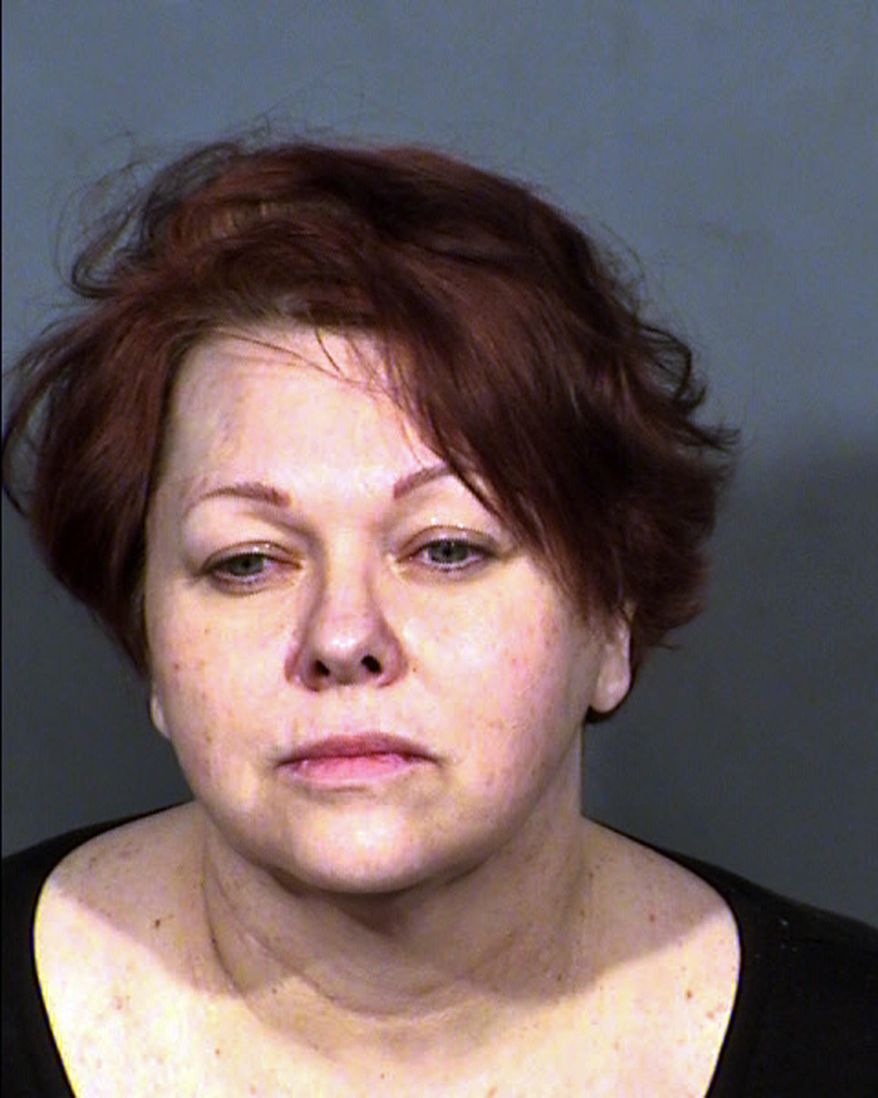 FILE - This undated Clark County Detention Center file booking photo shows April Parks. A former court-appointed financial guardian, her husband, her office manager and a lawyer have taken plea deals in what authorities called the biggest elder exploitation case ever prosecuted in Nevada. Parks, Gary Neil Taylor and Mark Simmons each pleaded an equivalent of no contest Monday, Nov. 5, 2018, in Las Vegas to multiple felonies stemming from overbilling and thefts that prosecutors said totaled more than $550,000 from hundreds of victims. (Clark County Detention Center via AP, File)