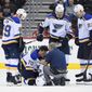 FILE — In this Sept. 30, 2018, file photo, St. Louis Blues center Oskar Sundqvist (70), of Sweden, is tended to by a trainer after he was checked by Washington Capitals right wing Tom Wilson, not seen, during the second period of an NHL preseason hockey game, in Washington. Also seen are Blues defenseman Vince Dunn (29), St. Louis Blues left wing Mackenzie MacEachern (62) and St. Louis Blues right wing Dmitrij Jaskin (23), of Russia. Wilson has been suspended 20 games by the NHL for a blindside hit to the head of an opponent during a preseason game. Wilson&#39;s punishment was announced Wednesday, Oct. 3, 2018, just hours before the reigning Stanley Cup champion Capitals were to raise their banner and open their title defense by hosting the Boston Bruins to begin the regular season. (AP Photo/Nick Wass, File) **FILE**