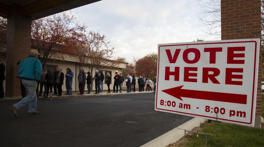 Voters wait in line as the polls open at Pierce Park Baptist Church in Boise, Idaho, Tuesday, Nov. 6, 2018. (AP Photo/Otto Kitsinger)