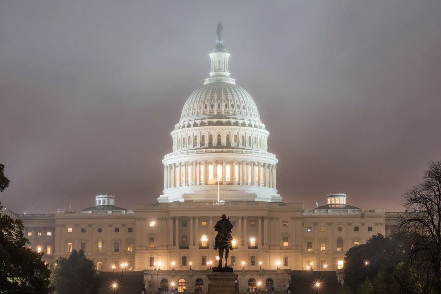 The U.S. Capitol Building in Washington is shrouded in fog early in the morning Tuesday, Nov. 6, 2018, on Election Day in the U.S. (AP Photo/J. David Ake)