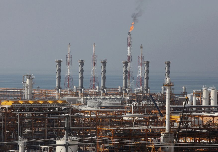 In this Jan. 22, 2014, file photo, a partially constructed gas refinery at the South Pars gas field is seen on the northern coast of Persian Gulf in Asalouyeh, Iran. (AP Photo/Vahid Salemi, File)