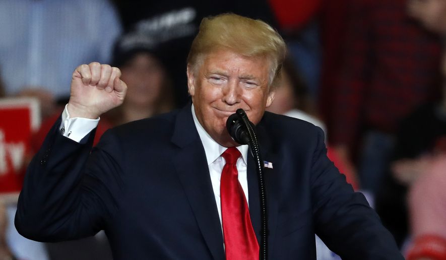President Donald Trump pumps his fist as he speaks during a campaign rally Monday, Nov. 5, 2018, in Cape Girardeau, Mo. (AP Photo/Jeff Roberson)
