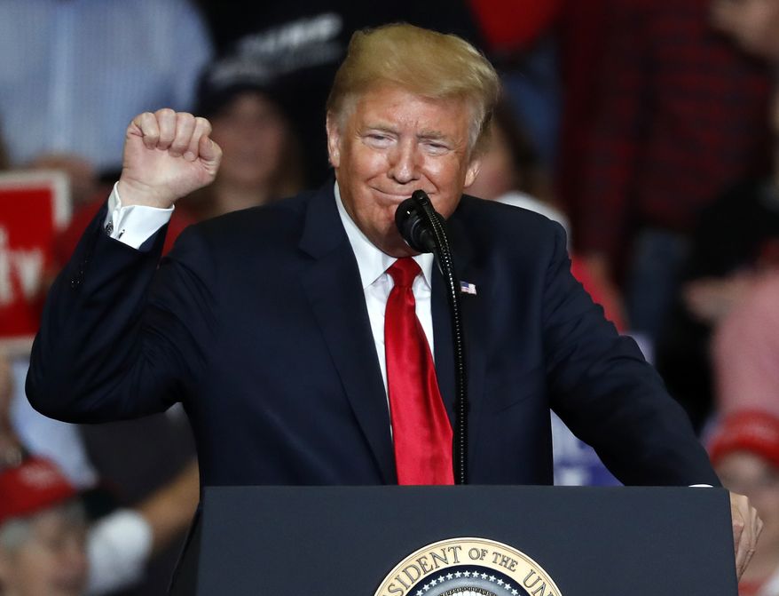 President Donald Trump pumps his fist as he speaks during a campaign rally Monday, Nov. 5, 2018, in Cape Girardeau, Mo. (AP Photo/Jeff Roberson)