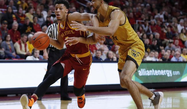 Iowa State guard Lindell Wigginton, left, drives past Alabama State center Branden Johnson during the first half of an NCAA college basketball game Tuesday, Nov. 6, 2018, in Ames, Iowa. (AP Photo/Charlie Neibergall)