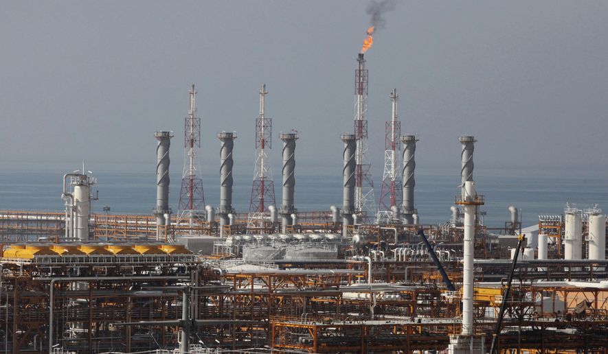 FILE - In this Jan. 22, 2014, file photo, a partially constructed gas refinery at the South Pars gas field is seen on the northern coast of Persian Gulf in Asalouyeh, Iran. Japan, South Korea and other major oil importers welcomed Tuesday the decision by the Trump administration to let them continue to import Iranian crude oil and other petroleum products despite the re-imposition of sanctions on Tehran. (AP Photo/Vahid Salemi, File)