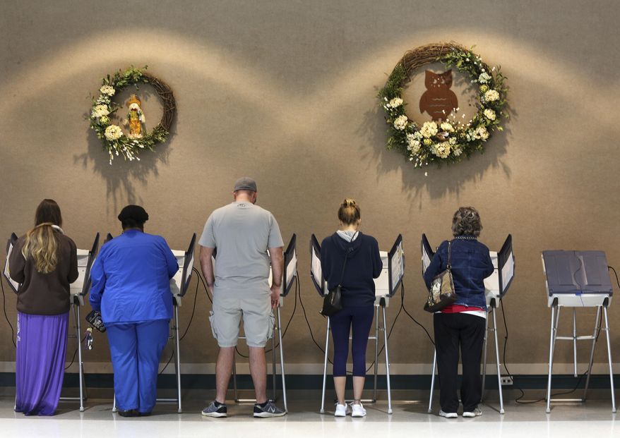 Voters cast their ballots Tuesday, Nov. 6, 2018, at Rossville City Hall in Rossville, Ga. (Erin O. Smith/Chattanooga Times Free Press via AP)