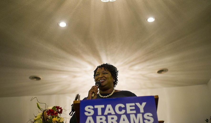 Stacey Abrams vowed to file a federal lawsuit over the way Georgia&#39;s elections are run. &quot;It was not a free and fair election,&quot; (Alyssa Pointer/Atlanta Journal-Constitution via AP)