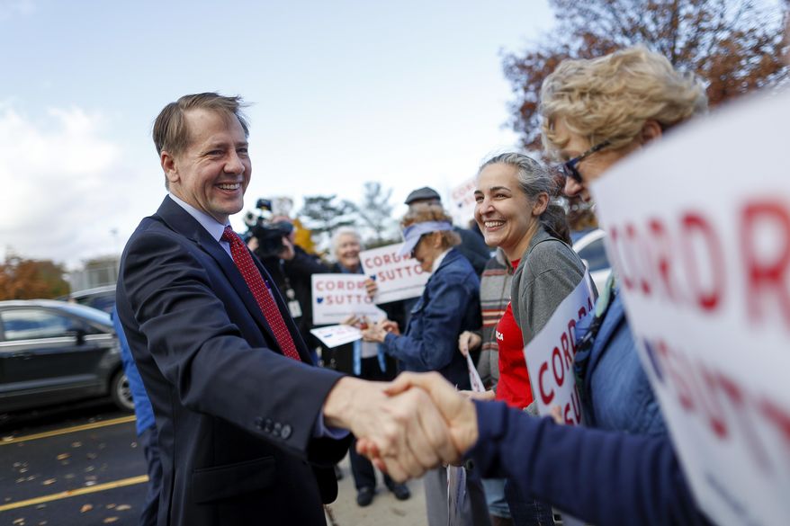 Ohio Democratic gubernatorial candidate Richard Cordray greets supporters at the Whetstone Community Center polling location, Tuesday, Nov. 6, 2018, in Columbus, Ohio. Across the country, voters headed to the polls Tuesday in one of the most high-profile midterm elections in years. (AP Photo/John Minchillo)