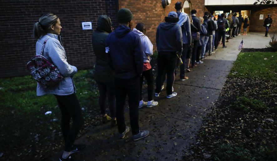 Voters arrive at the Tuttle Park Recreation Center polling location, Tuesday, Nov. 6, 2018, in Columbus, Ohio. Across the country, voters headed to the polls Tuesday in one of the most high-profile midterm elections in years. (AP Photo/John Minchillo)