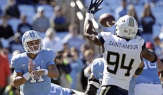 FILE - In this Saturday, Nov. 3, 2018, file photo, North Carolina quarterback Nathan Elliott (11) has a pass blocked by Georgia Tech&#39;s Anree Saint-Amour (94) during the first half of an NCAA college football game in Chapel Hill, N.C. Saint-Amour, coming off a big game in a win over North Carolina, is a big reason the Yellow Jackets rank among the nation&#39;s leaders in turnovers forced as they prepare to play Miami on Saturday. (AP Photo/Gerry Broome, File)