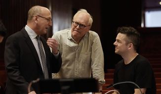 This Oct. 11, 2018 photo released by the Metropolitan Opera shows Composer Nico Muhly, right, with general manager Peter Gelb, left, and librettist Nicholas Wright during rehearsals for &amp;quot;Marnie,&amp;quot; at the Metropolitan Opera in New York. (Ken Howard/Metropolitan Opera via AP)