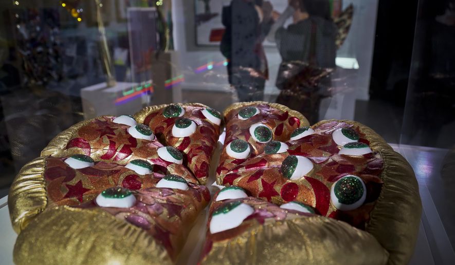 This Nov. 2, 2018 photo shows a textile sculpture from artist Hein Koh called "Mystic Pizza," part of a group art exhibition celebrating pizza at The Museum of Pizza in New York. (AP Photo/Bebeto Matthews)