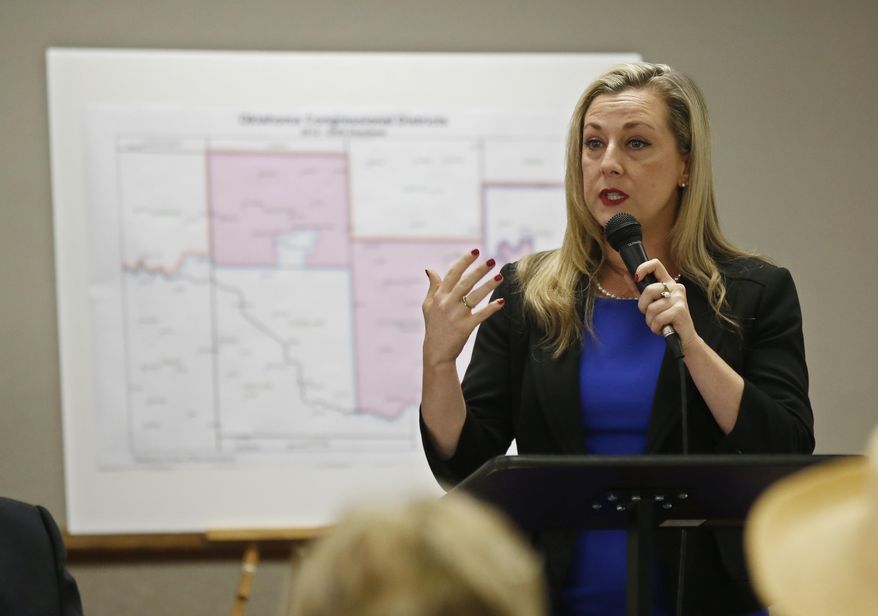 In this May 10, 2018 file photo, Kendra Horn speaks during a forum for Oklahoma 5th congressional district seat Democratic candidates in Edmond, Okla. Horn, who won election to the U.S. House in the 2018 general election, has been working to highlight poor housing conditions on U.S. military bases, including in her district. (AP Photo/Sue Ogrocki, File)