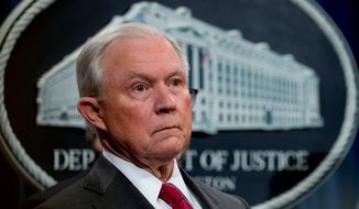 Then-Attorney General Jeff Sessions listens to reporters at a news conference in mid-October at the Justice Department in Washington. (Associated Press)