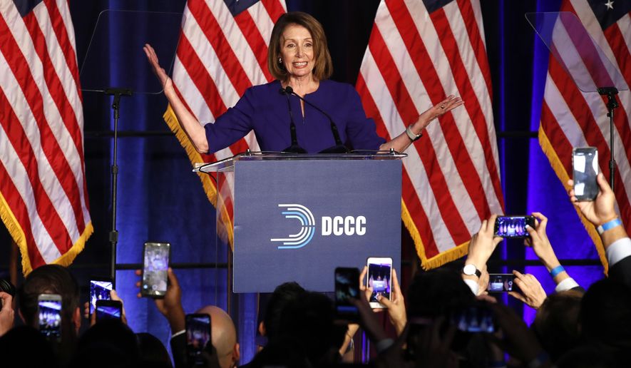 House Minority Leader Nancy Pelosi of Calif., smiles as she is cheered by a crowd of Democratic supporters during an election night returns event at the Hyatt Regency Hotel, on Tuesday, Nov. 6, 2018, in Washington. (AP Photo/Jacquelyn Martin)
