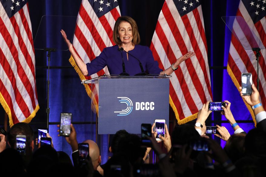 House Minority Leader Nancy Pelosi of Calif., smiles as she is cheered by a crowd of Democratic supporters during an election night returns event at the Hyatt Regency Hotel, on Tuesday, Nov. 6, 2018, in Washington. (AP Photo/Jacquelyn Martin)