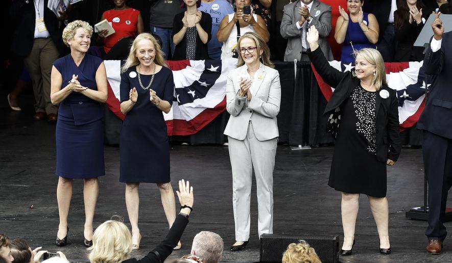 In this Sept. 21, 2018 photo, Pennsylvania congressional candidates, from left, Chrissy Houlahan, Mary Gay Scanlon, state Rep. Madeleine Dean and Susan Wild, take part in a campaign rally in Philadelphia. Each of the Democratic candidates won their elections on Nov. 6 and are set to become the first women from Pennsylvania to serve full terms in Congress since 2014. (AP Photo/Matt Rourke)