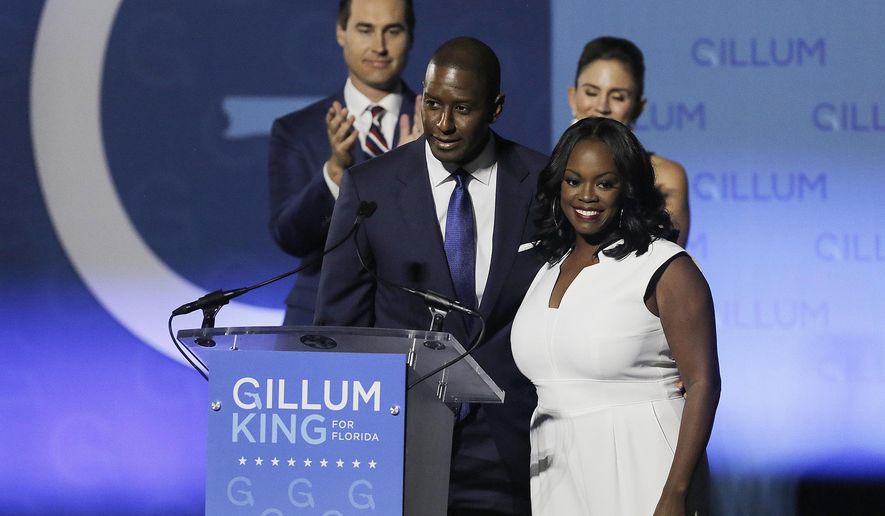 Florida Gubernatorial Democratic candidate Mayor Andrew Gillum gives his concession speech along side his wife First Lady R. Jai Gillum, running mate Chris King and his wife Kristen King on the campus Florida A&M University in Tallahassee, Fla., on Tuesday, Nov. 6, 2018. (Octavio Jones/The Tampa Bay Times via AP)