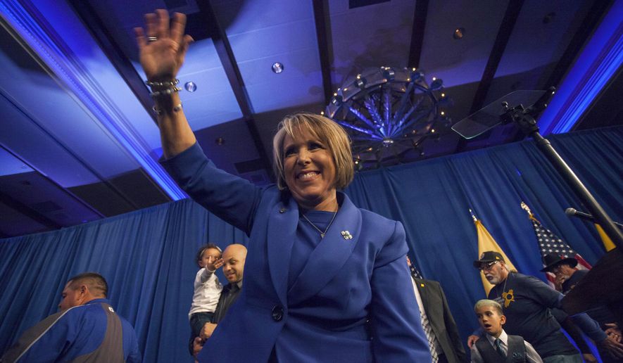 New Mexico Gov.-elect Michelle Lujan-Grisham waves to supporters following her acceptance speech in Albuquerque, N.M. Tuesday, Nov. 6, 2018. (AP Photo/Juan Labreche)
