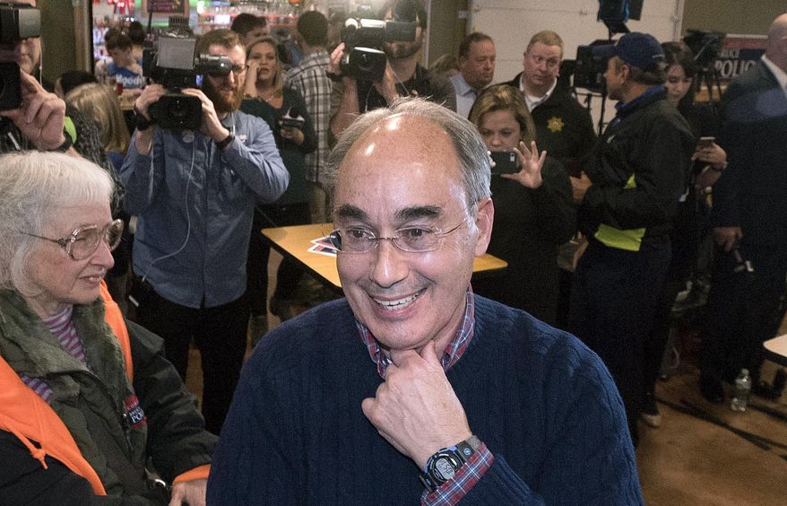 Republican U.S. Rep. Bruce Poliquin, seeking re-election in the 2nd Congressional District, greets supporters at his election night party, Tuesday, Nov. 6, 2018, in Bangor, Maine. (Gabor Degre/The Bangor Daily News via AP)