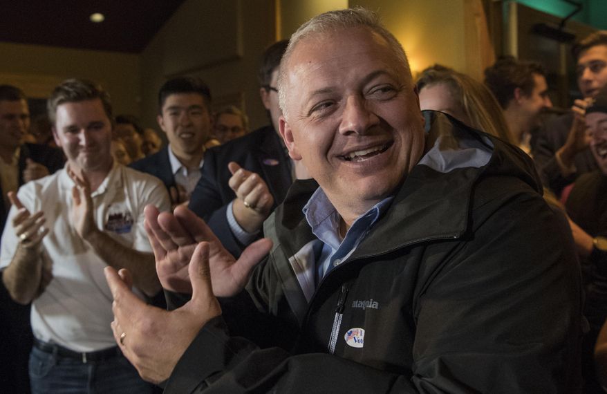 Republican congressional candidate Denver Riggleman claps with the crowd during an election party in Afton, Va., Tuesday, Nov. 6, 2018. (AP Photo/Lee Luther Jr.)