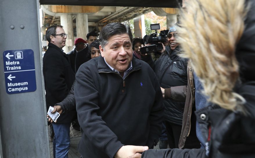 Illinois Gov.-elect J.B. Pritzker makes his first public appearance since election day to thank voters at the Roosevelt Street Orange and Green Line station in Chicago, Wednesday, Nov. 7, 2018. Pritzker capitalized on Republican Gov. Bruce Rauner's unpopularity and disfavor with GOP President Donald Trump to be elected Illinois governor. (Zbigniew Bzdak/Chicago Tribune via AP)