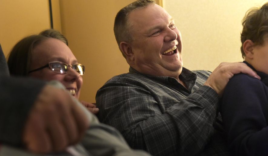Sen. Jon Tester awaits election results Tuesday, Nov. 6, 2018, surrounded by family member in Great Falls, Mont. Tester is running against Mont. State Auditor Matt Rosendale to keep his seat in the Senate.   (Thom Bridge/Independent Record via AP)
