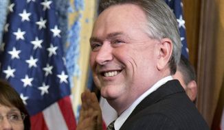 In this Jan. 3, 2013, file photo, then-Rep. Steve Stockman, R-Texas, participates in a mock swearing-in ceremony in Washington. (AP Photo/Evan Vucci, File) **FILE**