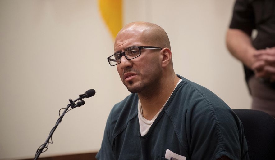 Federico Luis Cruz testifies before Judge Dennis Leiber at the Kent County Courthouse on Monday, Nov. 5, 2018. Cruz , serving life in prison without parole for killing and decapitating a teen in 1996 and mutilating the head in front of a video camera is getting a chance at a new sentence. (Neil Blake/The Grand Rapids Press via AP)