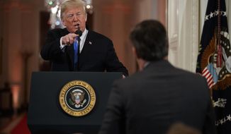 President Donald Trump speaks to CNN journalist Jim Acosta during a news conference in the East Room of the White House, Wednesday, Nov. 7, 2018, in Washington. (AP Photo/Evan Vucci) **FILE**