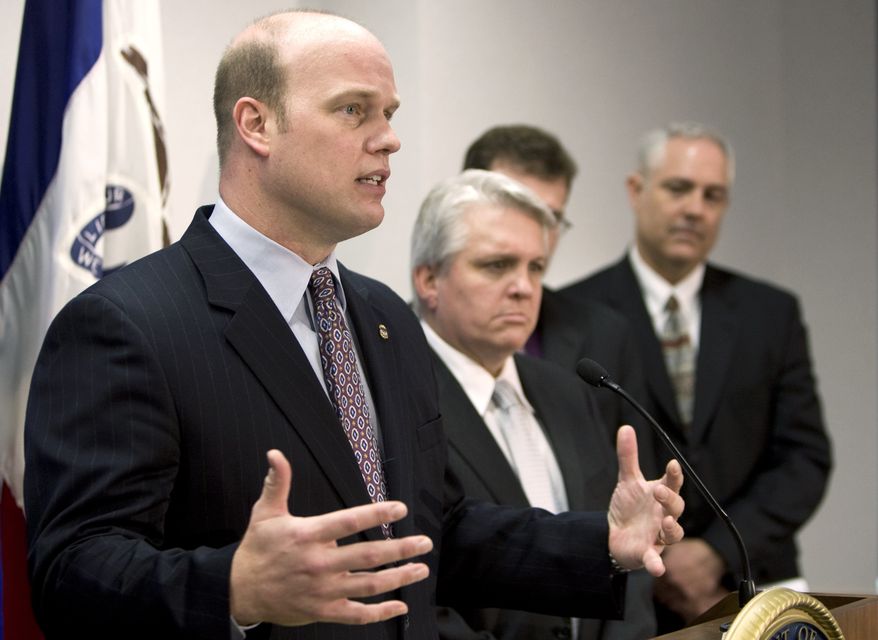 Southern District of Iowa United States Attorney Matthew Whitaker, left,  speaks during a news conference, Thursday, Feb. 12, 2009, in Des Moines, Iowa. Federal authorities announced the arrests and indictments of 11 people in six states as part of an investigation into visa and mail fraud.  (AP Photo/Charlie Neibergall)