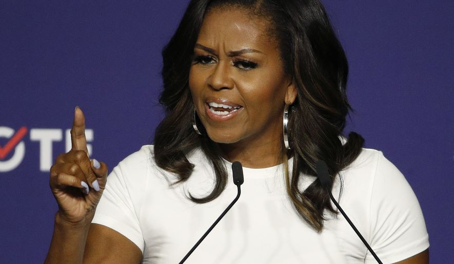 Former first lady Michelle Obama speaks at a rally to encourage voter registration Sunday, Sept. 23, 2018, in Las Vegas. (AP Photo/John Locher) ** FILE **