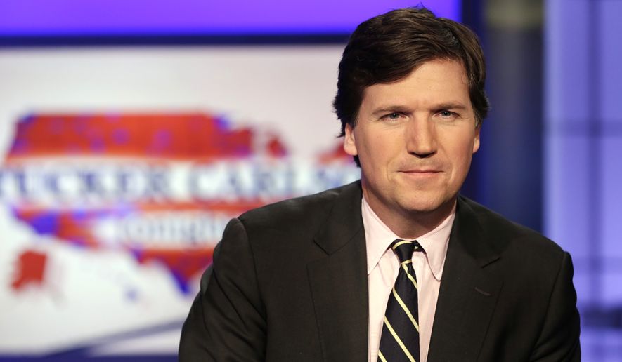 Tucker Carlson, host of &quot;Tucker Carlson Tonight,&quot; poses for photos in a Fox News Channel studio, in New York, Thursday, March 2, 2107. (AP Photo/Richard Drew) 