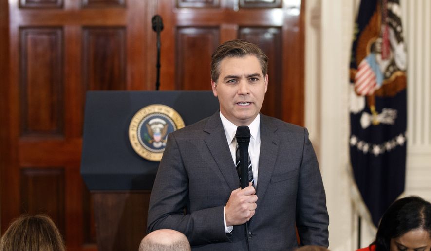 In this Nov. 7, 2018, photo, CNN journalist Jim Acosta does a standup before a new conference with President Donald Trump in the East Room of the White House in Washington. (AP Photo/Evan Vucci)