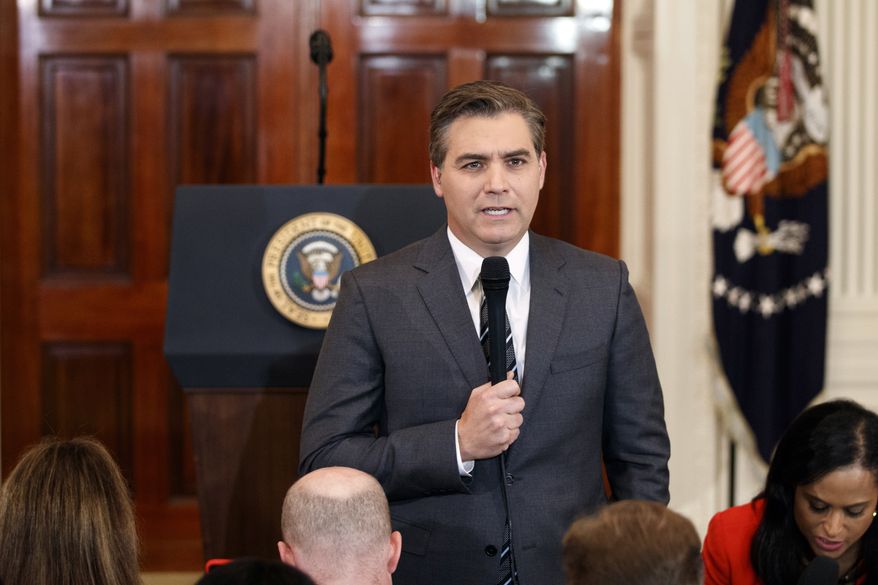 In this Nov. 7, 2018, photo, CNN journalist Jim Acosta does a standup before a new conference with President Donald Trump in the East Room of the White House in Washington. (AP Photo/Evan Vucci)