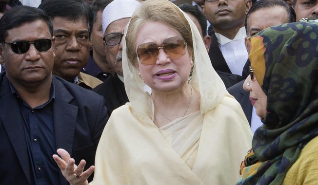 FILE- In this Dec. 28, 2017 file photo, Bangladesh&#x27;s former prime minister and opposition leader Khaleda Zia, center, leaves after a court appearance in Dhaka, Bangladesh.  Bangladesh&#x27;s Election Commission announced Thursday that the next national election will be held Dec. 23, despite the imprisonment of the main opposition leader. (AP Photo/A.M. Ahad, File)