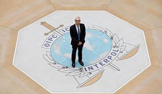 Interpol Secretary General Jurgen Stock poses a the international police agency in Lyon, central France, Thursday, Nov.8, 2018. Stock says that the international police organization&#39;s rules forbid him from probing the fate of the man who served as Interpol president until two months ago when he vanished on a trip to China, his homeland. (AP Photo/Laurent Cipriani)