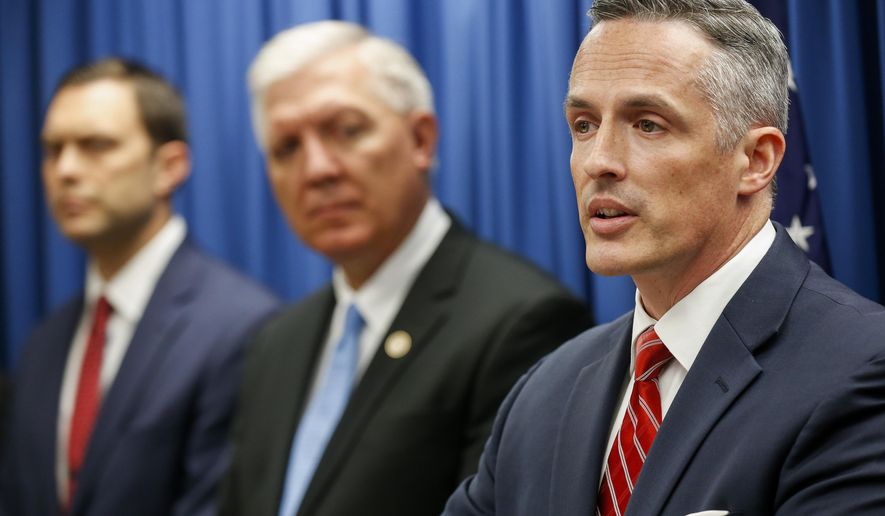 Tim Garrison, right, United States Attorney for the Western District of Missouri, speaks during a press conference on Thursday, Nov. 8, 2018 in Springfield, Mo., about the indictments against Kenneth Scott McKee, the captain of a duck boat that sank on Table Rock Lake in July, killing 17 people. (Andrew Jansen/The Springfield News-Leader via AP)